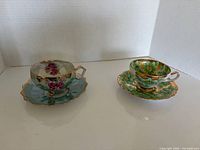 Overview of two teacup and saucer sets