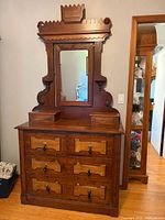 Full view of dresser with attached mirror