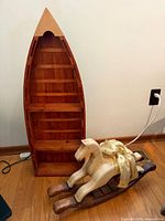 Boat shelf and rocking horse side by side