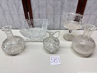 Group shot of all five clear cut glass pieces