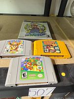 Front view of three N64 cartridges and GameCube case showing titles