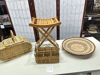 All four items: folding wooden stool, lidded picnic basket, divided basket with metal handle, round woven tray