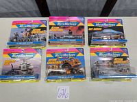 All six sealed Micro Machines carded packs displayed front facing