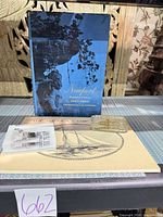 Group shot showing book, calendar and both paperweights