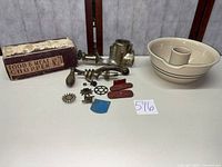 Overview of grinder components, stoneware bowl, and original box