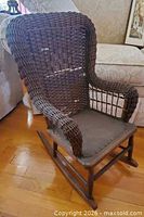Front view of child wicker rocking chair showing overall design
