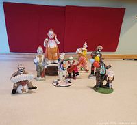 Group shot of all eight clown figurines