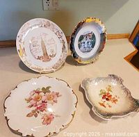 All four decorative plates displayed