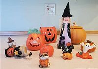 Group shot of all Halloween figurines and pumpkin decorations