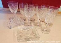 Group of eight goblets, triangular napkin holder, two square dishes