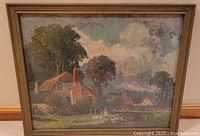 Full view of framed landscape painting