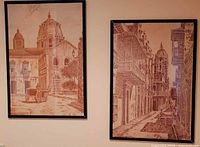Both framed sepia prints on wall