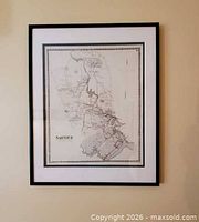Full view of framed map on wall