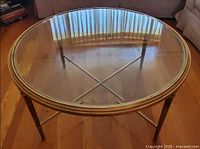 Top view showing round glass surface and metal rim
