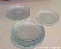 Three stacks of textured glass plates