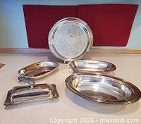 all five silver-plated pieces displayed