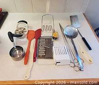 overview of all kitchen utensils arranged on countertop