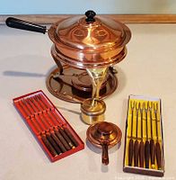 complete fondue set with forks displayed