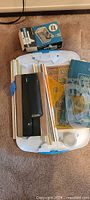 Top view of entire lot showing drafting board, templates, slide rules, lead pointer box