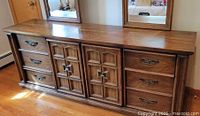 Front view of dresser showing drawers and doors