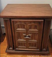 Front view of wooden nightstand closed