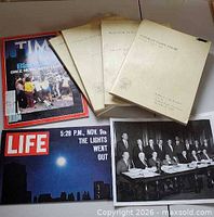 Magazines, reports and photo displayed together