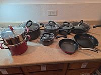 All cookware pieces arranged on countertop