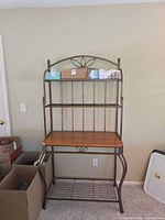 Full front view showing entire baker's rack with all three shelves