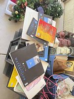 Stack of assorted art pads on table showing Canson XL Watercolor and others