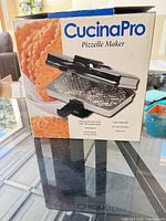 Retail box showing CucinaPro Pizzelle Maker image and labeling