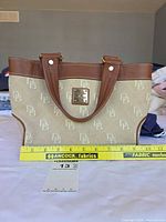 Front view of tote with ruler for scale