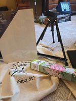 Group shot of artist panel, easel, Diamond Art kit, tote