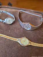 Group shot of the three women’s wristwatches showing overall design and finishes