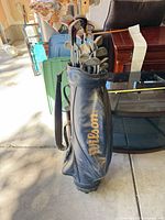 Wilson blue stand bag with clubs inside