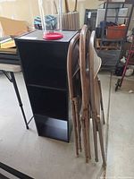 shelf front view with chairs folded at side