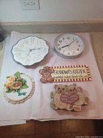 All five wall decor items laid out together