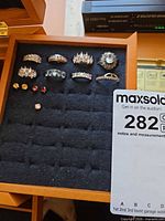Overview of rings and stud earrings in display tray