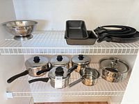 Full set on wire shelves: pots, pans, bowls, loaf pans