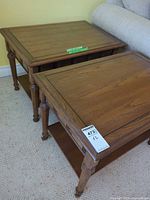 Both end tables next to sofa showing tops and general condition