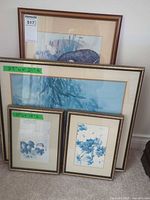 Group of three framed prints showing sizes and frames