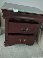 Front view showing both drawers and hardware