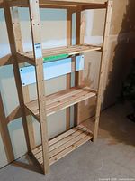 Full view of four-tier solid wood shelving unit