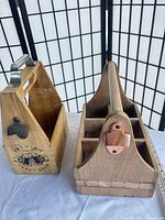 Both wooden bottle carriers side by side showing overall design and openers