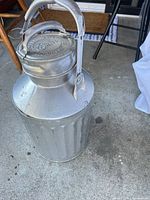Full view of galvanized Ellisco 5-gallon fuel can on concrete
