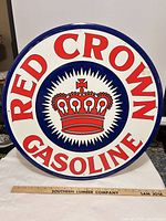 Full view of round Red Crown Gasoline sign