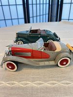 Both model cars side by side showing size and color contrast