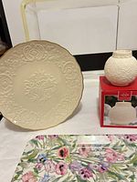 Group shot of Lenox plate, votive with box, and floral tray