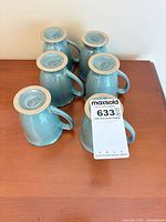 Six teal/light blue Denby mugs upside down full lot view