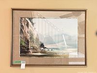 Full view of framed seascape print on wall