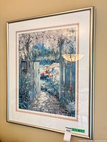 Full view of framed lithograph on wall